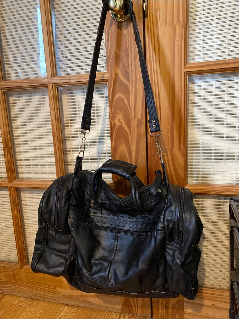 Classic Black Leather Duffel Bag with Detachable Strap